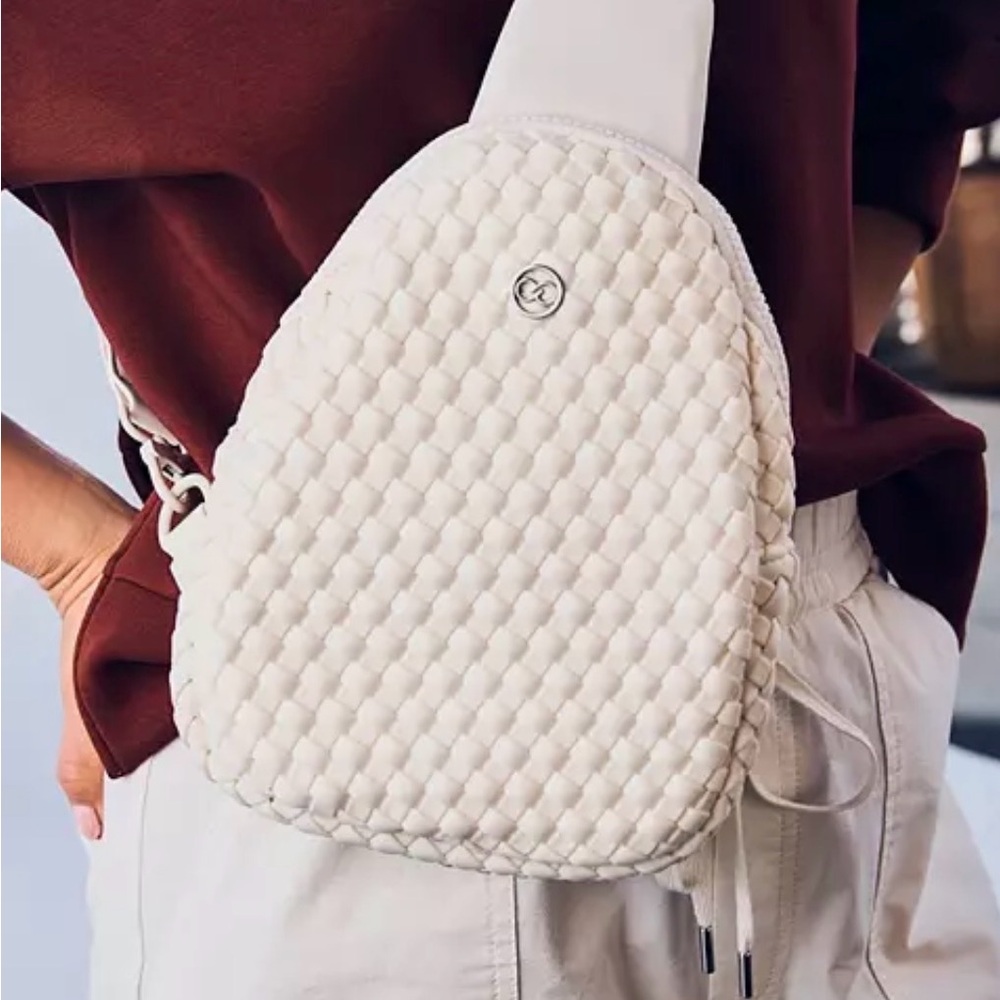 CALIA cream woven sling bag